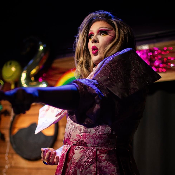 STRAPPED-IN! Queer Showcase Headshot